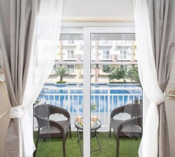 Mactan Export Processing Zone Apartment | AMANI 132B with Pool View, Near Airport, Mall, Free Pool, Gym, Netflix, 200 Mbps Wi-fi