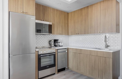 Vinegar Hill Apartment | Amazing Dumbo 2BR w/W/D, Roof & Gym, nr TimeOut Building, by Blueground