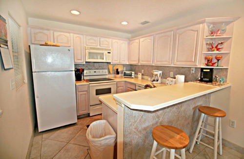 Crescent Beach Apartment | Amazing Ocean Views from this 3rd Floor unit! With a Pool, Beach Boardwalk, Boat