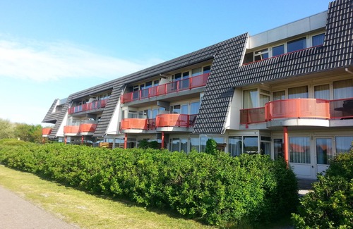 Municipality of Ameland Apartment | Ameland - apartment with balcony to the south side with a view of meadows and the village of Buren