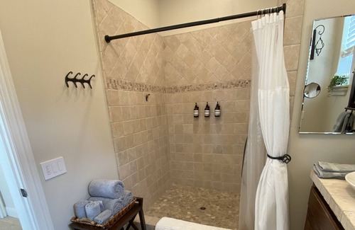 San Martin House | An elegant B&B with a pool & hot tub located above Moose Mountain Vineyards
