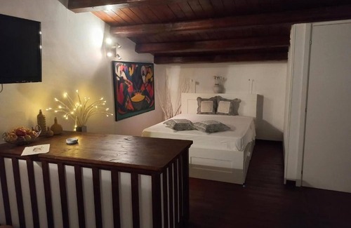 Portopalo di Capo Passero House | Apartment '3 Twins Suite Portopalo' with Shared Garden and Air Conditioning