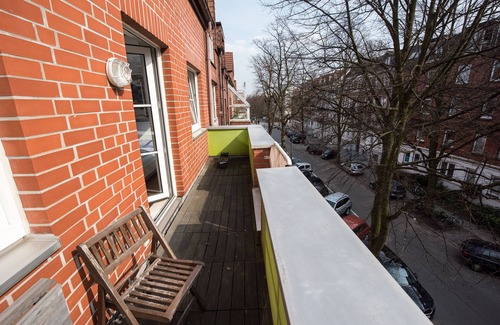 Eppendorf Apartment | Apartment Eppendorf balcony with Mid Century furniture near UKE central location