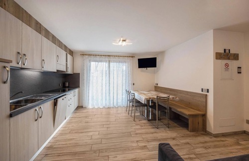 Predazzo Apartment | Apartment “Vacanze Arcobaleno - Viola” with Mountain View, Sauna & Whirlpool