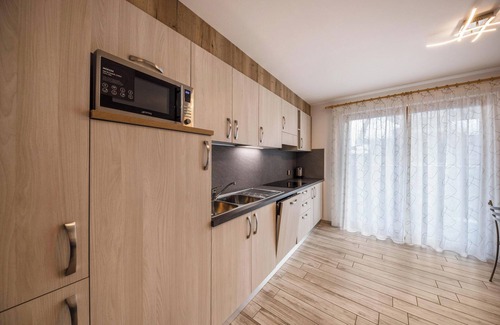 Predazzo Apartment | Apartment “Vacanze Arcobaleno - Viola” with Mountain View, Sauna & Whirlpool