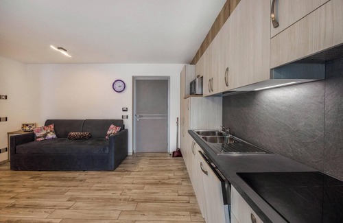 Predazzo Apartment | Apartment “Vacanze Arcobaleno - Viola” with Mountain View, Sauna & Whirlpool