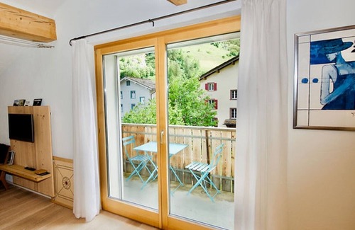 Vals Apartment | Apartment with south-facing balcony, wonderful view of the mountains, close to the ski bus stop
