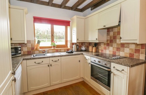 Watchet Cottage | ASH LODGE, pet friendly, with hot tub in Washford