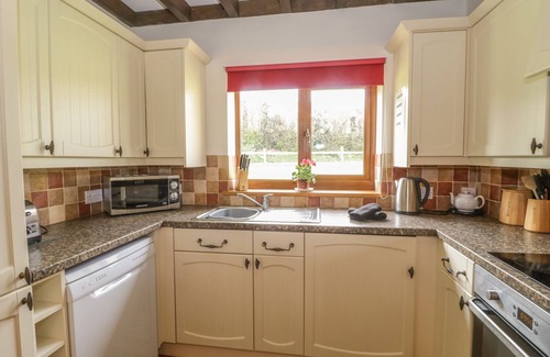 Watchet Cottage | ASH LODGE, pet friendly, with hot tub in Washford