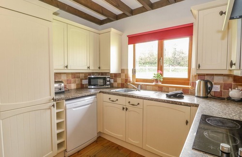 Watchet Cottage | ASH LODGE, pet friendly, with hot tub in Washford