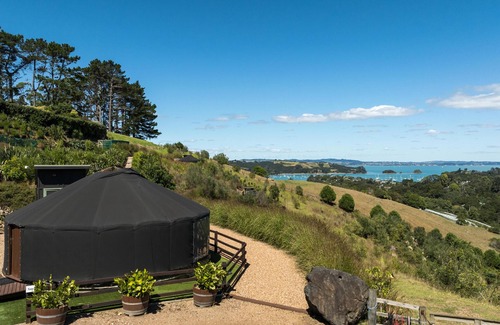 Palm Beach Cabin | Awaawa Yurts - Papa Yurt - Awaawa Yurts offer a luxury glamping experience on Waiheke Island. Stunning views, luxury queen sized bed, private bathroom with tea and coffee making facilities.