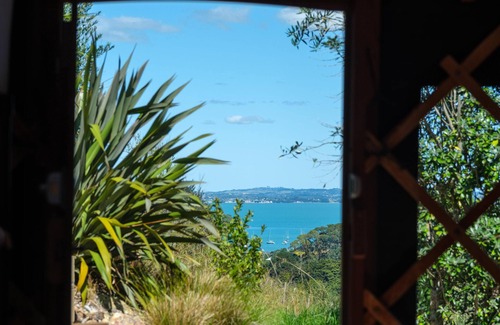 Palm Beach Cabin | Awaawa Yurts - Rangi Yurt - Awaawa Yurts offer a luxury glamping experience on Waiheke Island. Stunning views, luxury queen sized bed, private bathroom with tea and coffee making facilities.