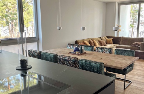 Bad Saarow Apartment | Bad Seerose, cozy vacation apartment with lake view, roof terrace, pool and sauna