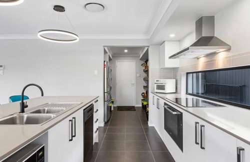 Banksia Beach House | Bailies Retreat - Modern townhouse with pool plus lake and golf course views