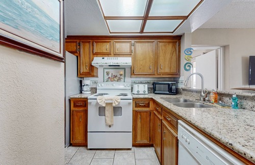 South Padre Island Condo | Bay-view all-suite condo with pool & fishing dock - walk to beach