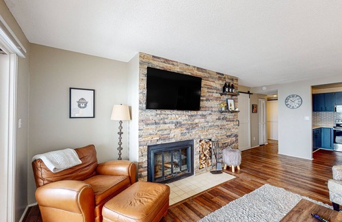 Maple City Condo | Bayfront condo with lake & bay views, deck, 2 fireplaces, private washer/dryer