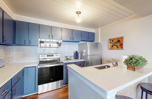 Maple City Condo | Bayfront condo with lake & bay views, deck, 2 fireplaces, private washer/dryer