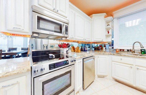 Port Isabel House | Bayfront home with dock, private elevator, central AC & grill -snowbird-friendly