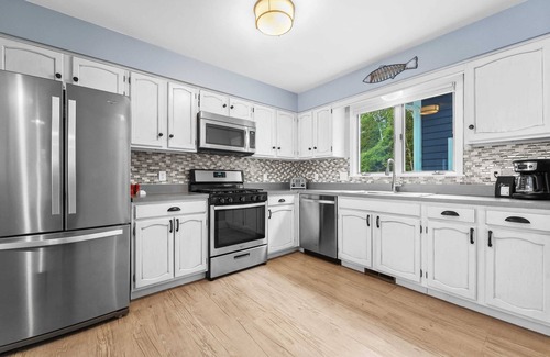 Suttons Bay House | Bayside Serenity with Hot Tub! Dog Friendly!