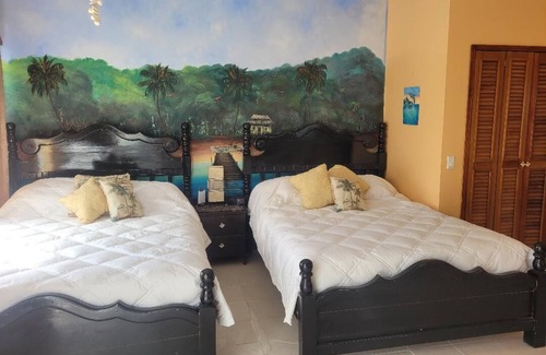 San Pedro Resort | Beach front in wonderful San Pedro with WiFi AC, pool, fitness room, kitchenette