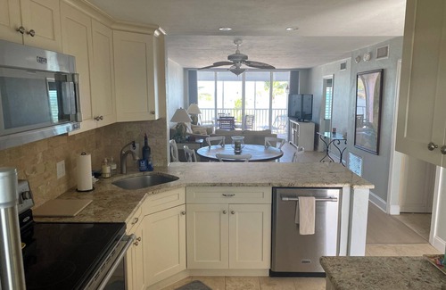 South Island Condo | Beach front paradise! Steps to the beach with unforgettable sunsets.