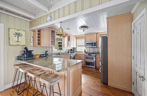 Litchfield by the Sea House | Beach House on Tidal Creek, Dock, Screen Porch, Easy Walk to Beach, Dog Friendly