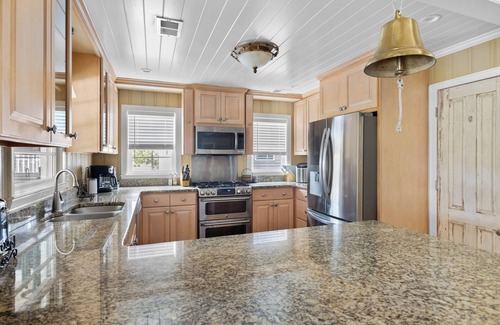 Litchfield by the Sea House | Beach House on Tidal Creek, Dock, Screen Porch, Easy Walk to Beach, Dog Friendly