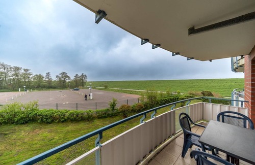 Schillig Apartment | Beachfront 3-room apartment with balcony located directly on the North Sea dike -