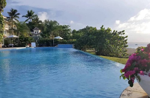 Playa Chiquita Apartment | Beachfront condo in downtown Sosua, guest-friendly, sea views