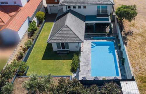 Halls Head House | Beachfront Family Favourite Home with Pool & Views