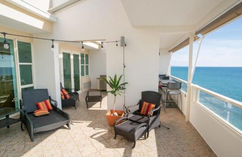 Stella Apartment | Beachfront Penthouse with Ocean and Sunset Views at Pelican Reef #703
