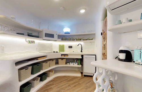 Cocoplum Villa | Beachfront retreat with pool, private hot tub, AC, & lagoon view