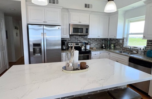 Miramar House | Beachfront, sand steps away, pet friendly, large fenced yard