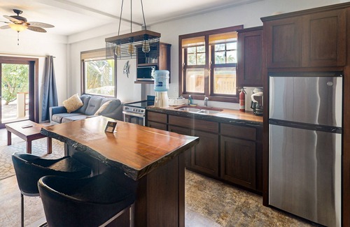 Caye Caulker House | Beachfront suite with reef views - pool, bikes, canoes, dock, and grill access