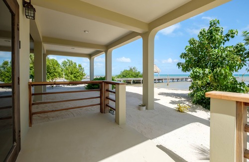 Caye Caulker House | Beachfront suite with reef views - pool, bikes, canoes, dock, and grill access