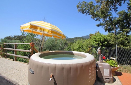 Castiglione della Pescaia House | Beautiful private villa for 3 guests with A/C, hot tub, TV, veranda, pets allowed and panoramic .