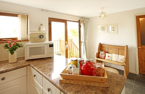Cemaes Bay Cottage | Beautiful 19th Century Seaside Cottage with hot tub and river views