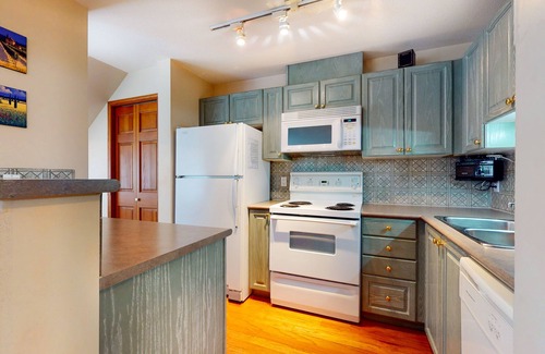 Village North Condo | Beautiful 1st-floor condo with fireplace & patio, short walk or shuttle to lifts