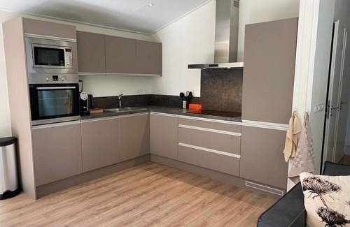 Noordoostelijk van Schaarsbergen House | Beautiful apartment in villa for 4 people with WIFI, pool, TV and terrace