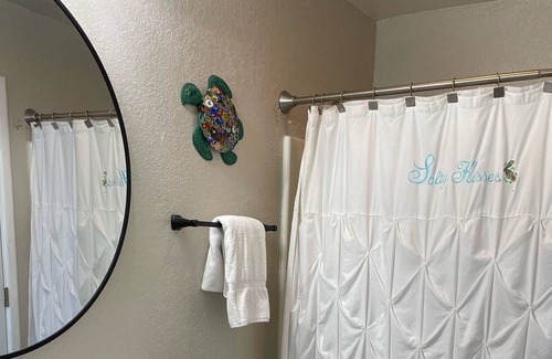 Carova Beach Cottage | Beautiful Canal front home in 4x4 area beach parking passes and linens included!