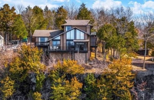 Osage Beach House | Beautiful lake front sunset view, you can hear waves crashing against the bluff