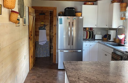 Greenville House | Beautiful lakefront camp with sunset view over big moose mountain
