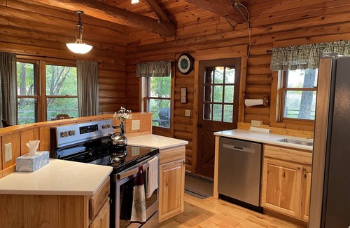 Lawrence Cabin | Beautiful log cabin with all the creature comforts of home. Private fishing lake