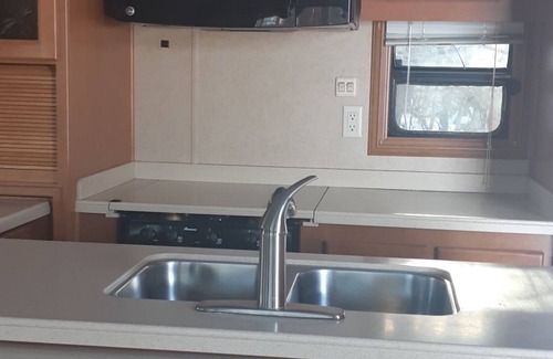 Manitoba RV Rental | Beautiful RV with a hot tub, at Ofty's Riverside Campground.