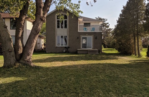 Pointe aux Roches House | Beautiful waterfront oasis this home is perfect for your next family vacation!