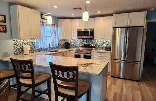 Naples Park House | Beautifully Decorated Beach Cottage with Sparkling Heated Pool