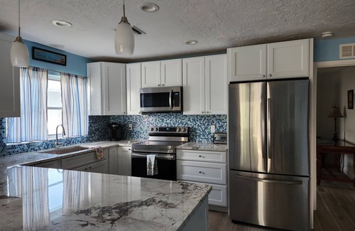 Naples Park House | Beautifully Decorated Beach Cottage with Sparkling Heated Pool