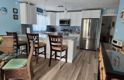 Naples Park House | Beautifully Decorated Beach Cottage with Sparkling Heated Pool