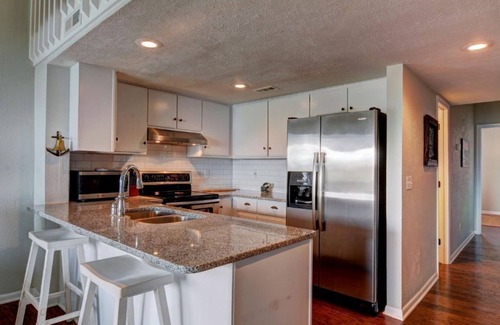 Surf City Condo | Beautifully Updated TOP FLOOR Condo with Ocean & Pool Views