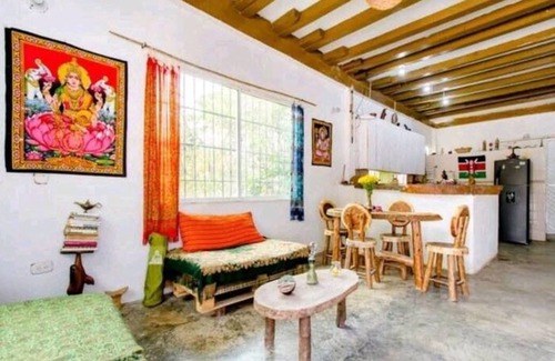 Papare House | Bedroom with air conditioning and private bathroom near the beach.